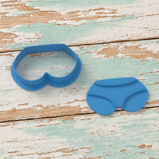 Bikini Bottoms cookie cutter and matching embosser on coastal timber.