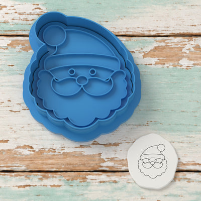 Cute Santa Claus Face cutter and embosser with a rendered fondant impression example.