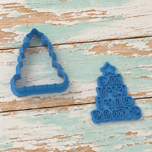 Merry Christmas Tree cookie cutter and matching embosser on coastal timber.