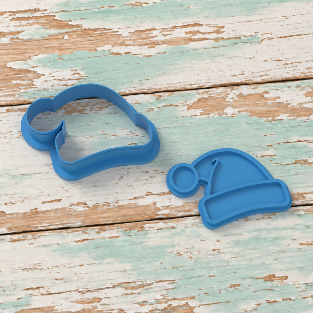 Santa Hat cookie cutter and matching embosser on coastal timber.