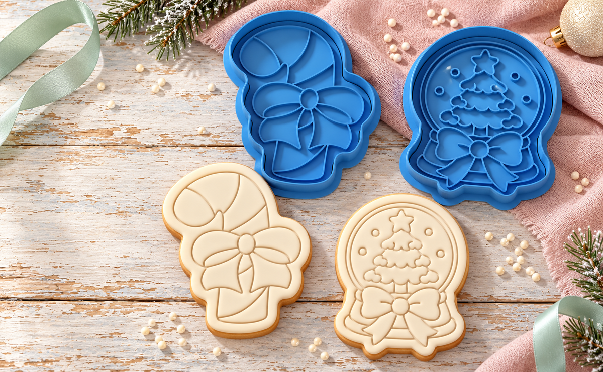 Blue cookie cutters and matching fondant cookies in a festive bows scene
