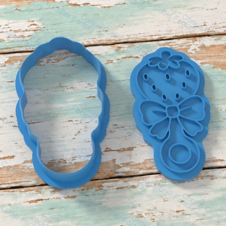 Strawberry Rattle With Bow Cookie Cutter and Embosser Stamp | CCF_APPROVED_MEDIA_V1:2:8f5bc2aa4f55400650cc1280c259cbb5b107f59fab9e806f360c113127a94592