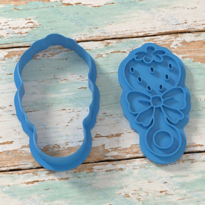 Strawberry Rattle With Bow Cookie Cutter and Embosser Stamp | CCF_APPROVED_MEDIA_V1:2:8f5bc2aa4f55400650cc1280c259cbb5b107f59fab9e806f360c113127a94592