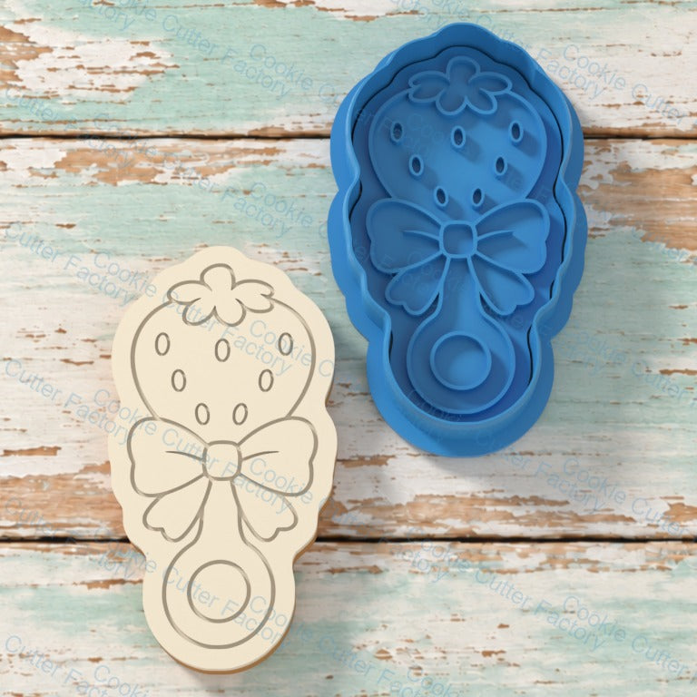 Strawberry Rattle With Bow Cookie Cutter and Embosser Stamp | CCF_APPROVED_MEDIA_V1:1:bb83b835a45e1f6b9ab7b574d698564dc2d7189dc956e0616e2c169e5ff4be5f