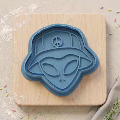 Alien in Bucket Hat Cookie Cutter and Embosser Stamp - Sci-Fi Party | CCF_APPROVED_MEDIA_V1:1:63fca209b140cae0faebfd942e2d9e9d973fab419a09697e9d02741a61b02c2b