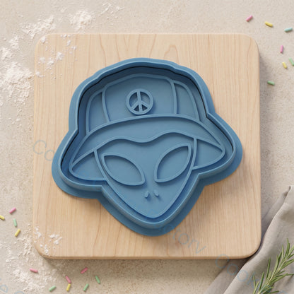 Alien in Bucket Hat Cookie Cutter and Embosser Stamp - Sci-Fi Party | CCF_APPROVED_MEDIA_V1:1:63fca209b140cae0faebfd942e2d9e9d973fab419a09697e9d02741a61b02c2b